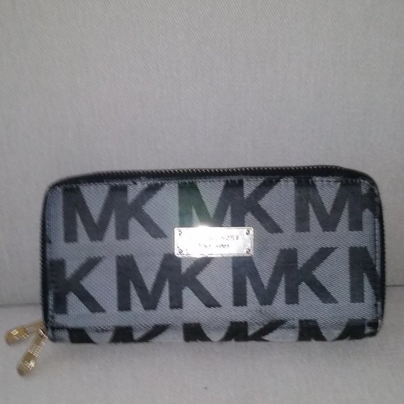 Michael Kors Handbags - Vintage Michael Kors signature zip around wallet